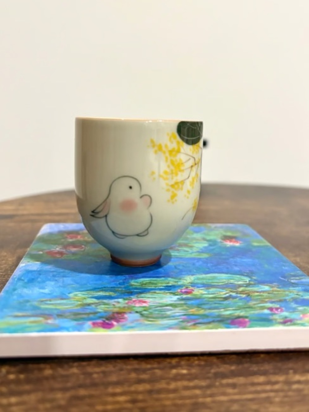 Cream Ceramic Cup with Yellow Blossom and Bird Motif